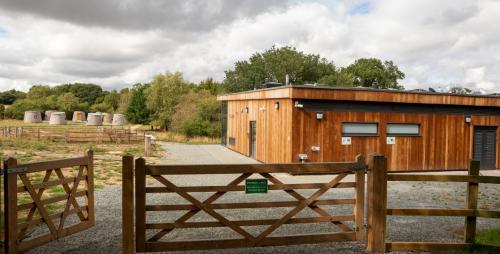 Entrance to field with wooden buildings